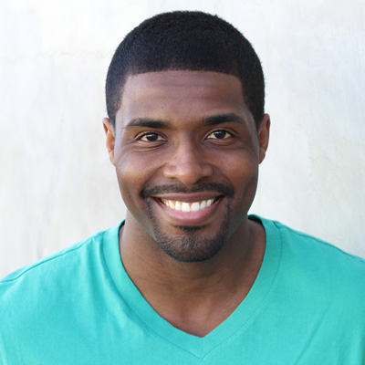 An elderly couple sharing a joyful moment, posing for the camera with smiles on their faces.